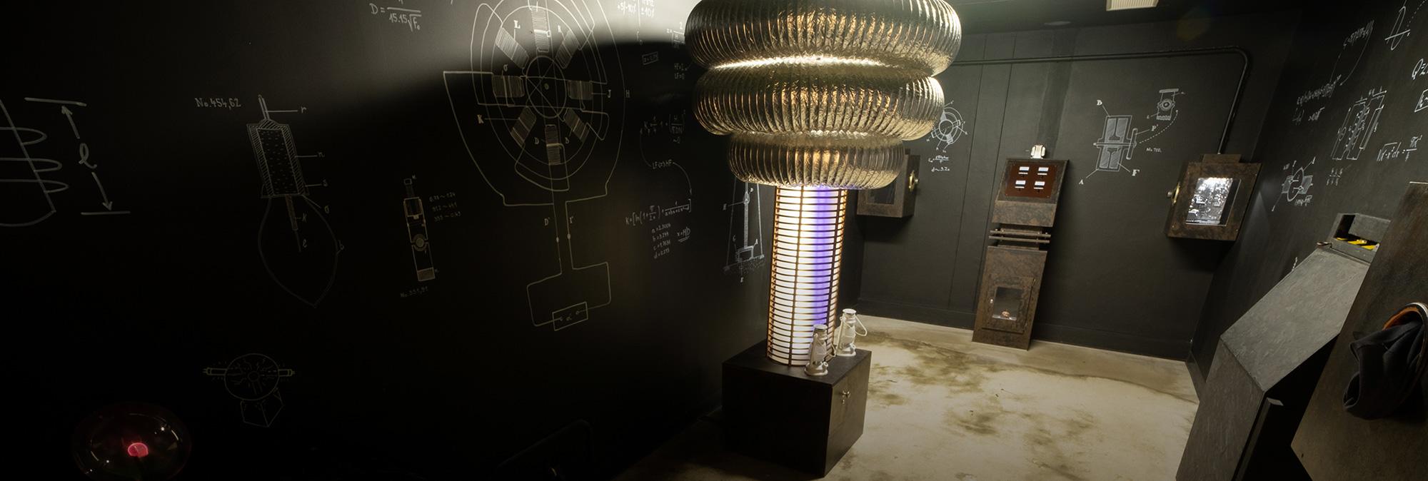 Close-up of glowing electrical devices and scientific instruments in Tesla’s Mystery escape room at Fox in a Box Hong Kong.
